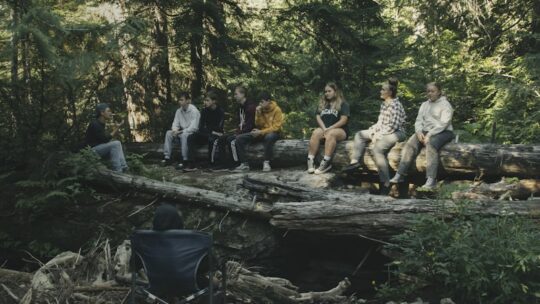 Team enjoying corporate retreat in natural setting