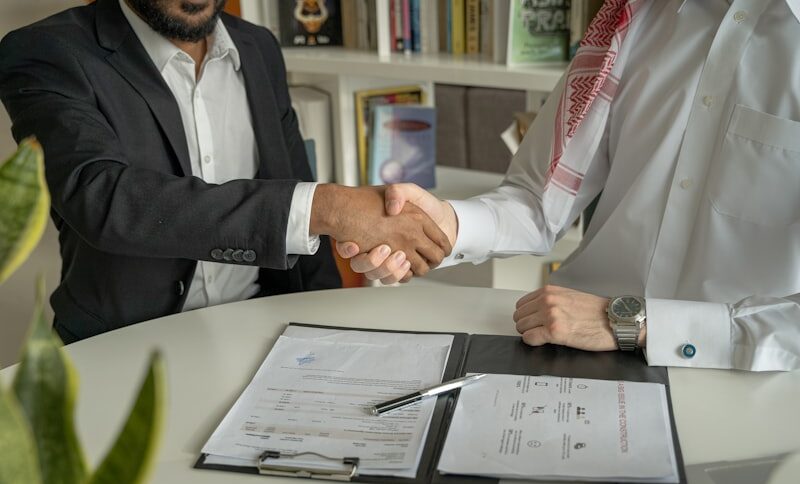 Business professionals navigating the first month of an acquisition