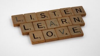 Leader actively listening to team member in professional setting