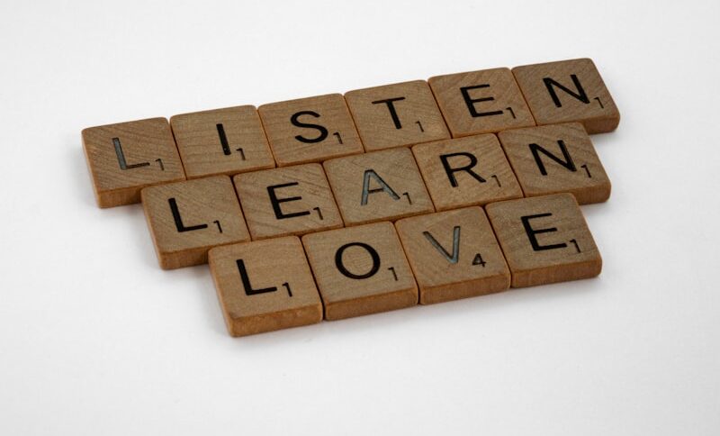 Leader actively listening to team member in professional setting